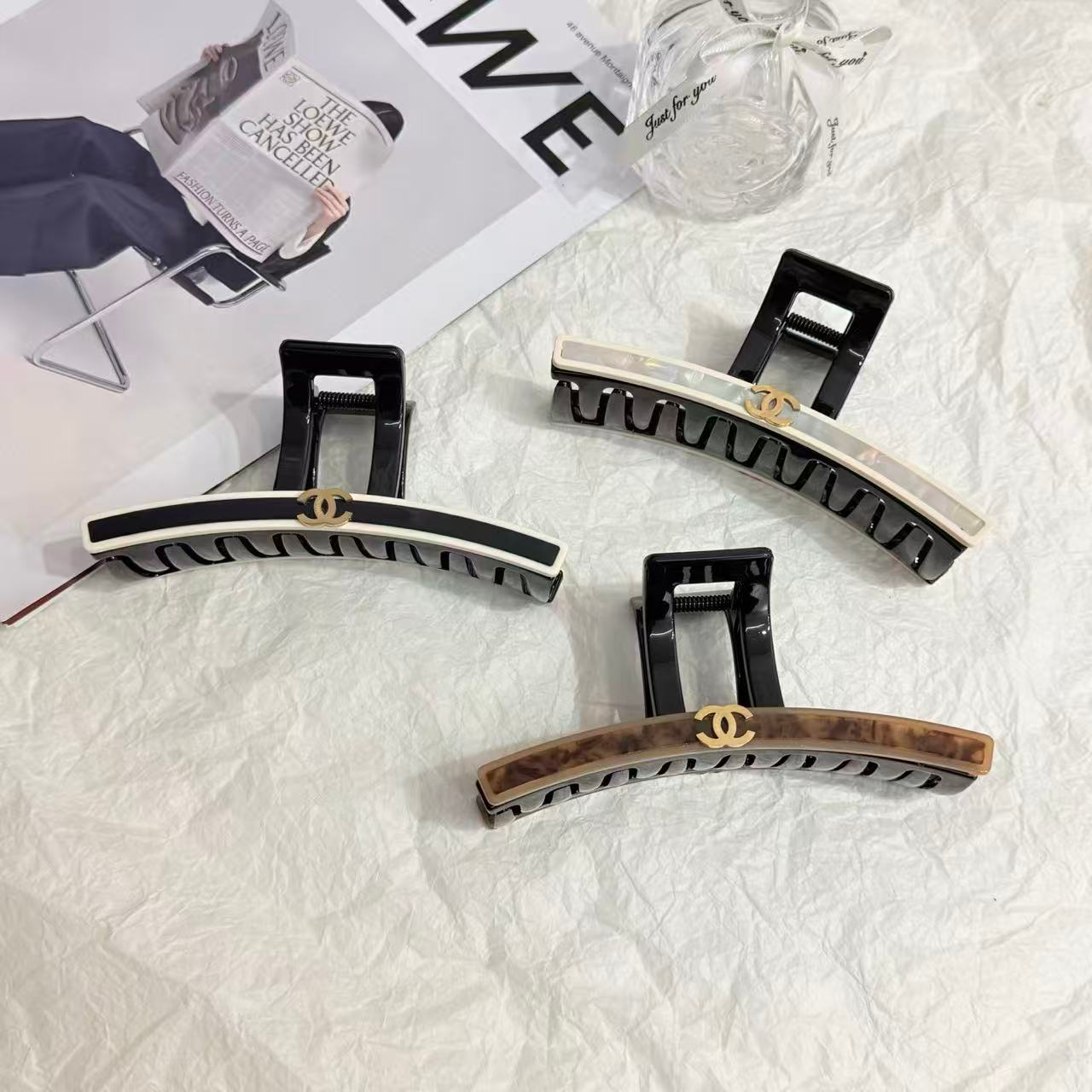 Hair sticks and pins securing small medium and large buns